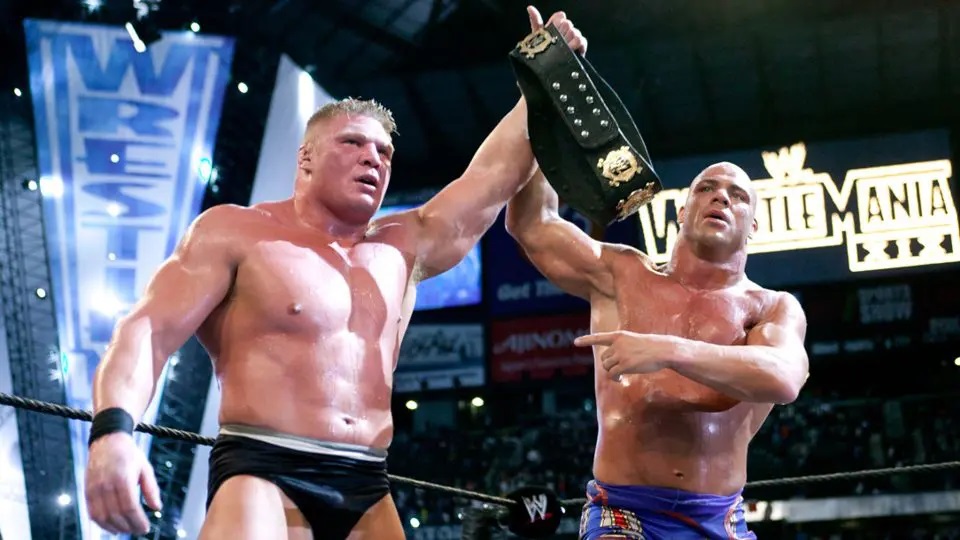 Kurt Angle raises Brock Lesnar's arm at WrestleMania 19