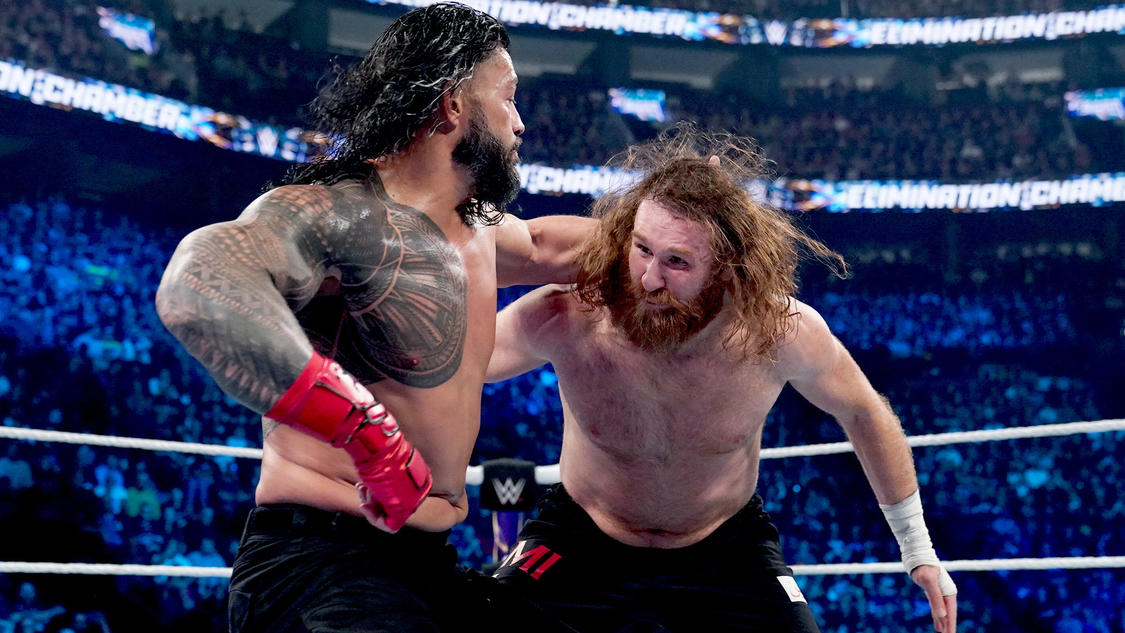 Roman Reigns punches Sami Zayn